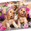 Puzzle Filhotes de Spaniel com chapéus de flores