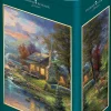 Puzzle Thomas Kinkade: o paraíso da natureza em uma caixa de lata